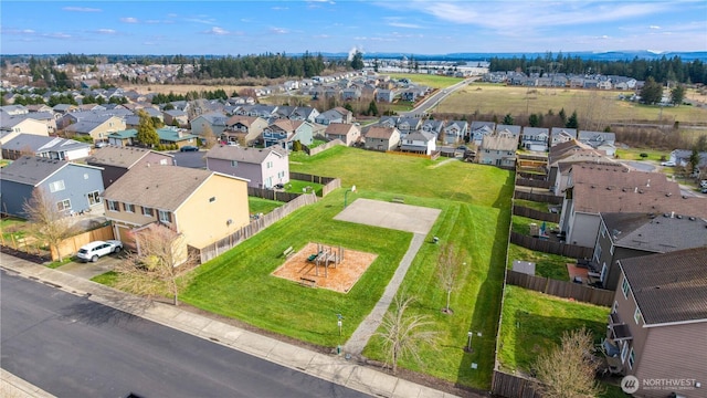 birds eye view of property with a residential view