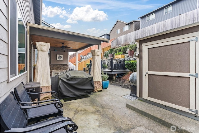 view of patio featuring fence and grilling area