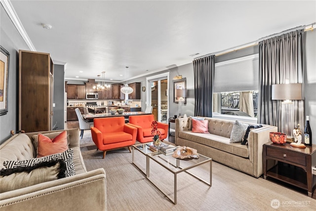 living room with recessed lighting, a notable chandelier, and ornamental molding