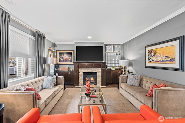 living room with recessed lighting, wood finished floors, a fireplace, and crown molding