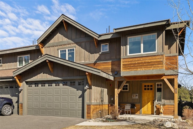 view of front of property featuring a garage, driveway, and board and batten siding