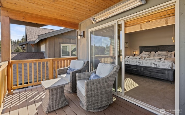 wooden deck with an outdoor living space