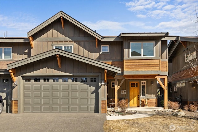 view of front of home featuring a garage, driveway, and board and batten siding