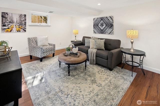 living area featuring visible vents, recessed lighting, wood finished floors, and baseboards