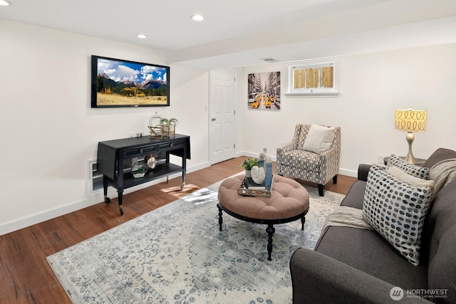 living area with visible vents, recessed lighting, baseboards, and wood finished floors