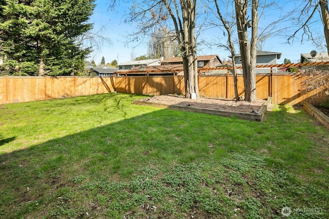 view of yard featuring a fenced backyard