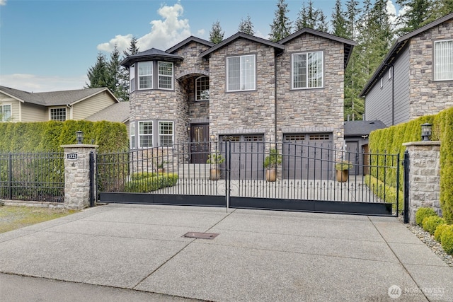 view of gate with a fenced front yard