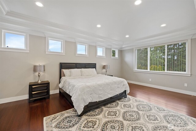 bedroom featuring recessed lighting, wood finished floors, baseboards, and ornamental molding