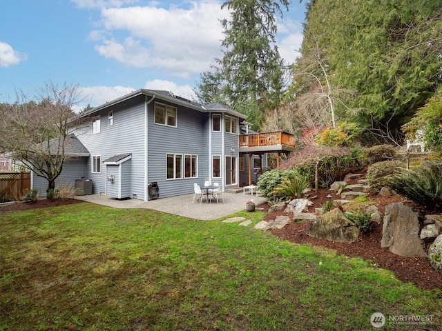 back of property featuring a patio, a lawn, and central AC unit