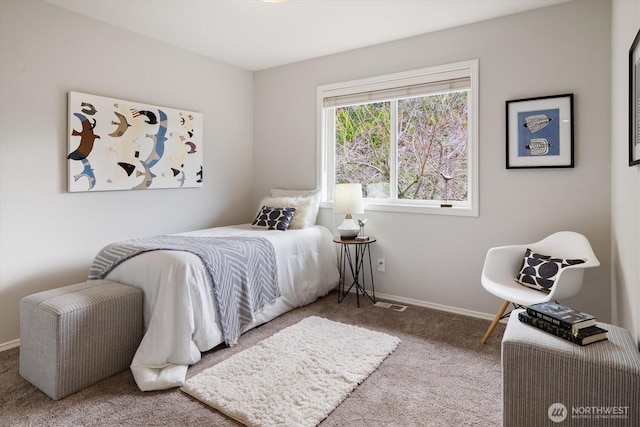 carpeted bedroom with baseboards