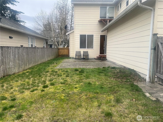 view of yard featuring a patio area and a fenced backyard