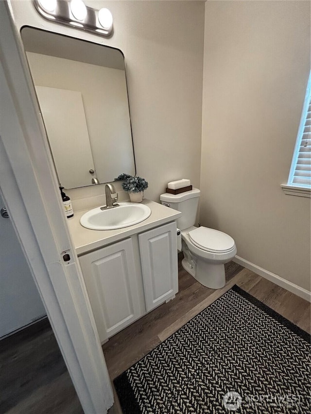2168 Mcdonald Ave, Dupont, WA 98327 - half bath featuring wood finished floors, toilet, and vanity