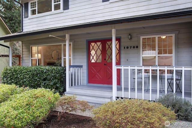 entrance to property featuring covered porch