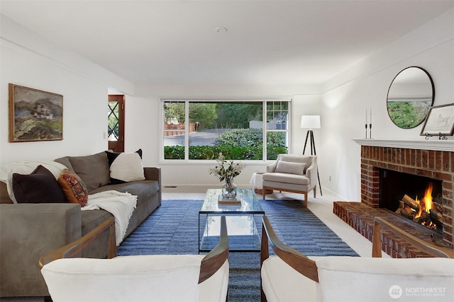 carpeted living area featuring a brick fireplace