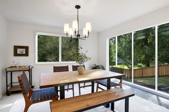 dining area with an inviting chandelier