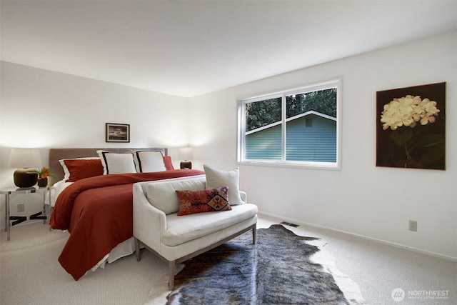 bedroom featuring carpet flooring and baseboards