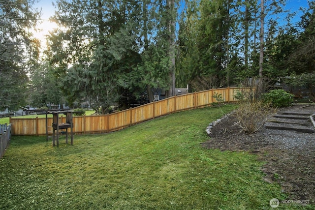 view of yard featuring a fenced backyard