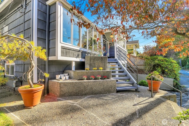 view of home's exterior with stairs