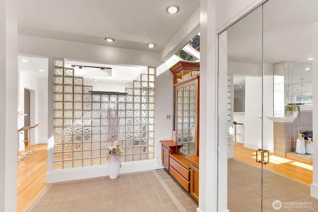 bathroom featuring recessed lighting and baseboards