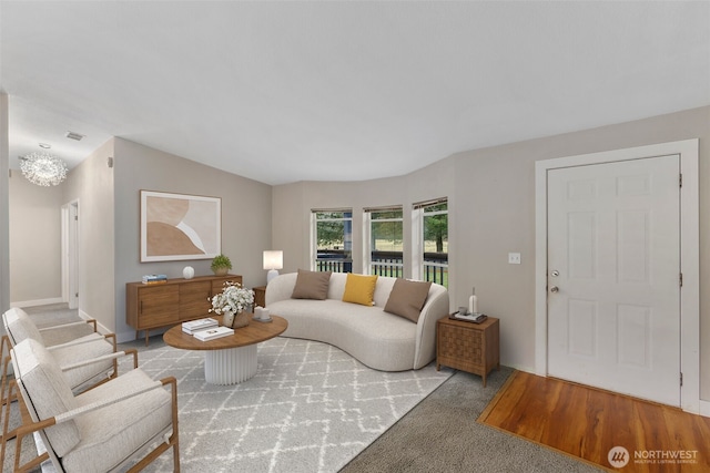 living area featuring an inviting chandelier