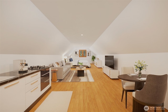 living room with light wood-style floors and vaulted ceiling