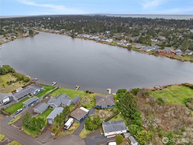 birds eye view of property featuring a residential view and a water view