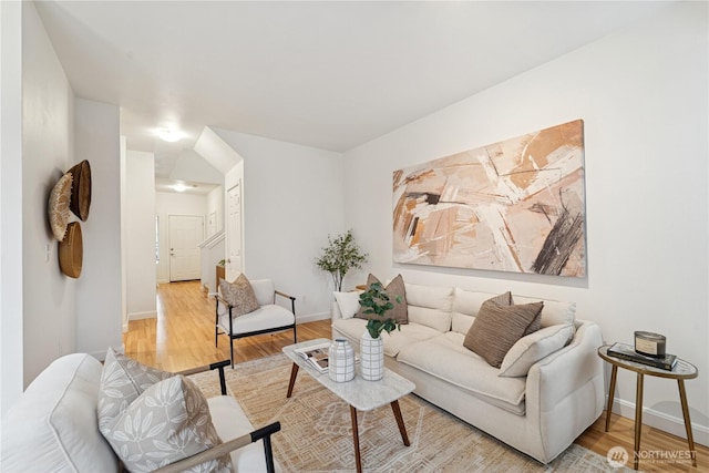 living area with wood finished floors and baseboards