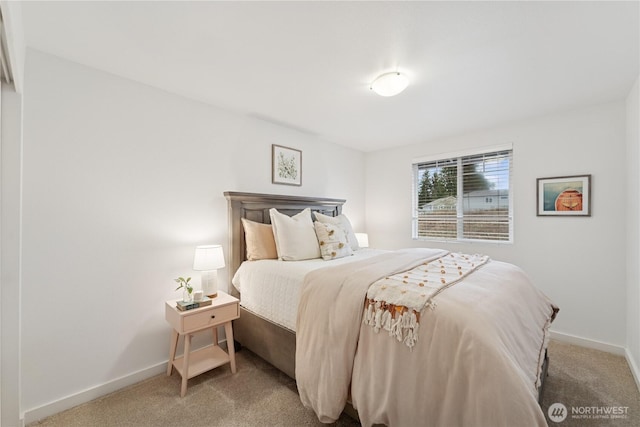 carpeted bedroom with baseboards