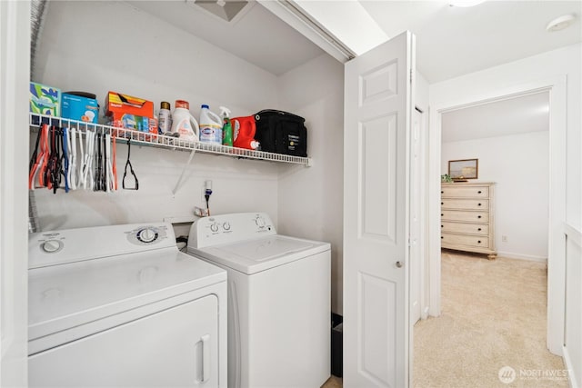 washroom with laundry area, separate washer and dryer, and light carpet