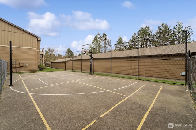 view of basketball court featuring community basketball court and fence