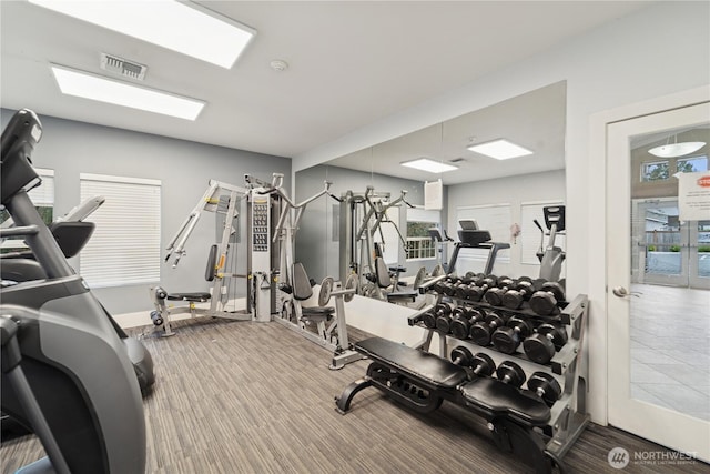 exercise room featuring visible vents