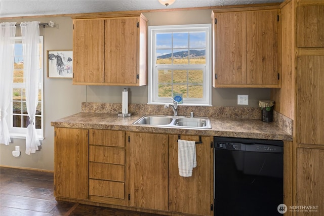 kitchen featuring a sink, black dishwasher, brown cabinetry, and dark wood-style flooring