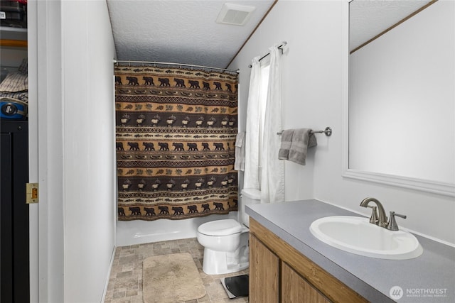 full bath with vanity, toilet, visible vents, and a textured ceiling