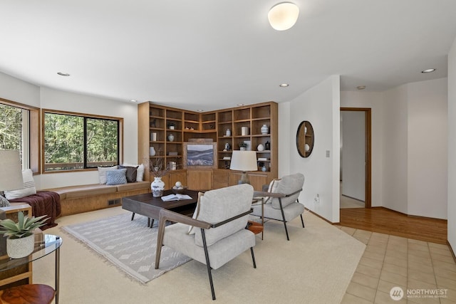 living area featuring recessed lighting and light tile patterned flooring