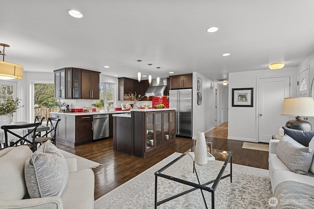 living area featuring recessed lighting and dark wood finished floors