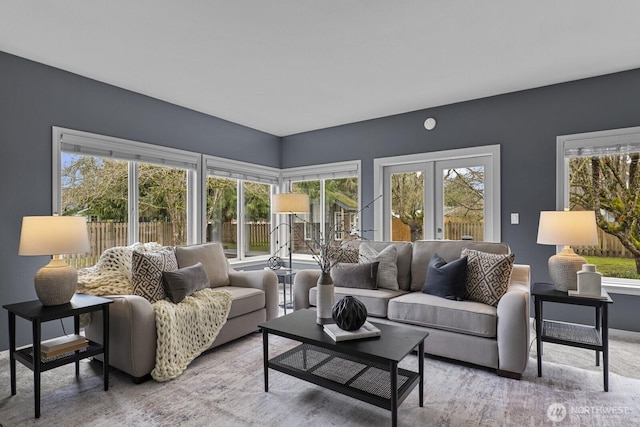 carpeted living room with french doors