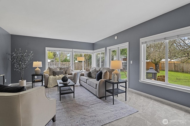 living room featuring baseboards and carpet floors