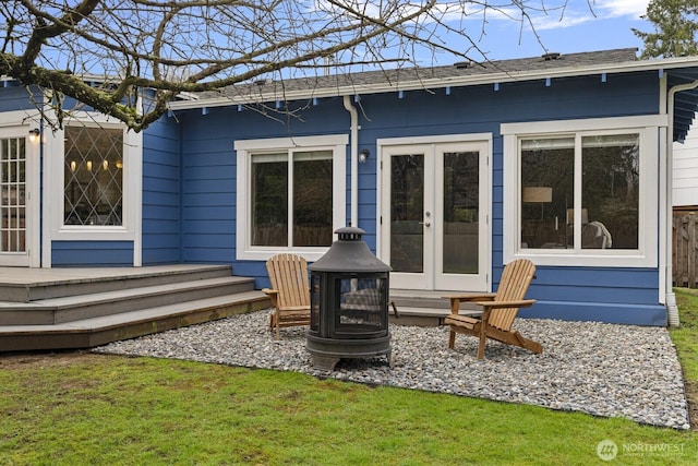 rear view of property with french doors