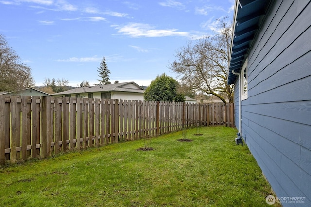 view of yard featuring a fenced backyard