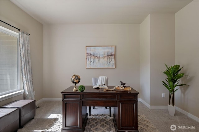 office featuring light carpet and baseboards