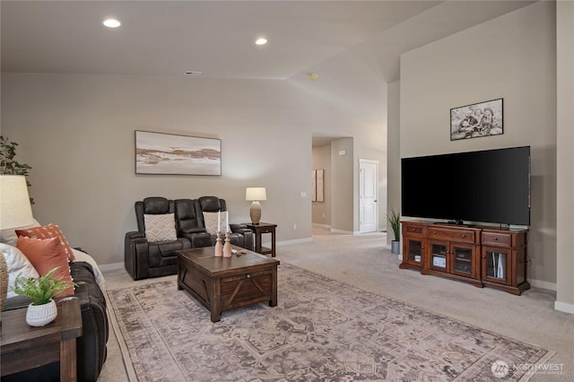 living area featuring lofted ceiling, recessed lighting, baseboards, and light colored carpet