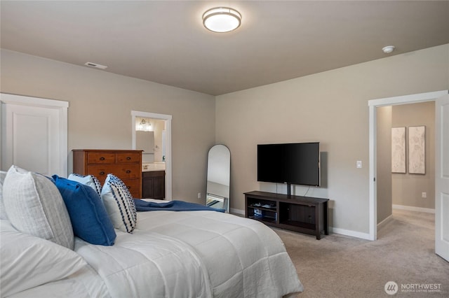 bedroom featuring light carpet, ensuite bath, visible vents, and baseboards