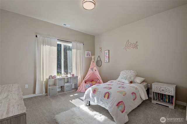 bedroom featuring carpet floors, visible vents, and baseboards