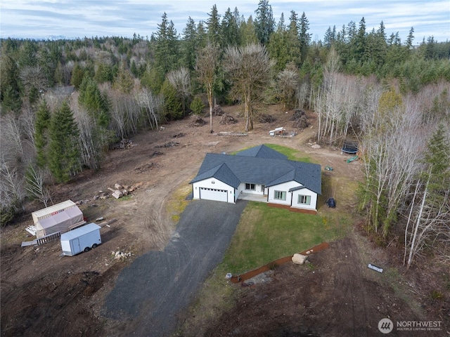 aerial view featuring a wooded view