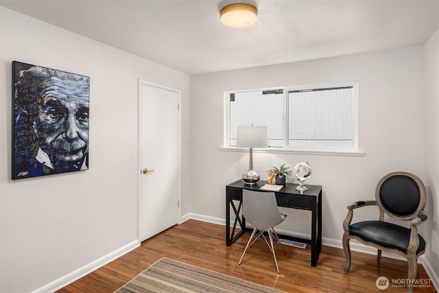 office area with baseboards and wood finished floors