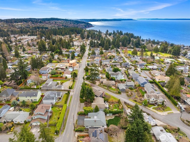 bird's eye view featuring a residential view and a water view