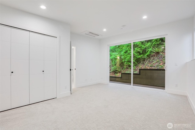 unfurnished bedroom featuring visible vents, carpet flooring, recessed lighting, and baseboards