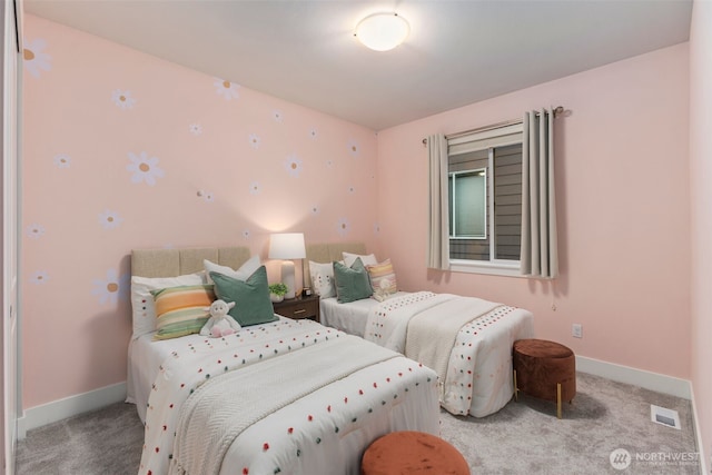 bedroom featuring baseboards, visible vents, and carpet floors