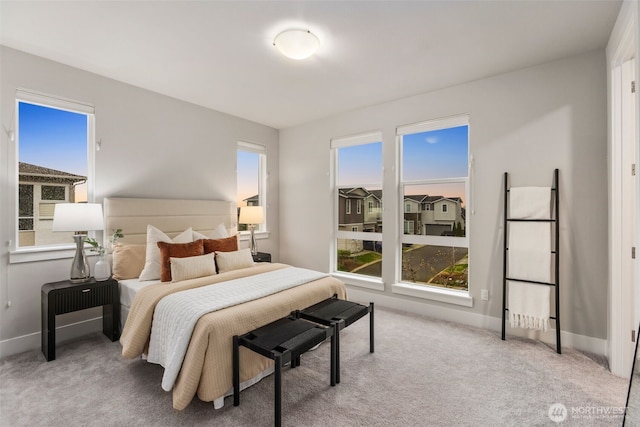 carpeted bedroom with baseboards