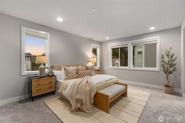 bedroom with light carpet, recessed lighting, and baseboards